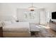 Spacious main bedroom with modern lighting, carpet, and large windows for natural light at 10339 Kensington Shore Dr # J-202, Orlando, FL 32827