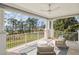 Inviting covered patio with comfortable seating and stunning views of the surrounding landscape at 10339 Kensington Shore Dr # J-202, Orlando, FL 32827