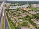 A picturesque aerial view of the apartment complex with nearby lake and surrounding greenery at 109 Oyster Bay Cir # 150, Altamonte Springs, FL 32701