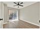 Bedroom features sliding glass doors and modern ceiling fan at 109 Oyster Bay Cir # 150, Altamonte Springs, FL 32701