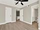 This bedroom features hard floors, neutral walls, white trim, and a ceiling fan at 109 Oyster Bay Cir # 150, Altamonte Springs, FL 32701