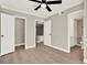 This bedroom features hard floors, neutral walls, white trim, and a ceiling fan at 109 Oyster Bay Cir # 150, Altamonte Springs, FL 32701