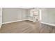 Bright living room featuring wood-look flooring and an open layout to the kitchen at 109 Oyster Bay Cir # 150, Altamonte Springs, FL 32701