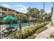 Community pool with lounge chairs and umbrellas at 109 Oyster Bay Cir # 150, Altamonte Springs, FL 32701