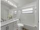 Updated bathroom with vanity, tub-shower combo with tile, and great lighting at 1135 Marni Ridge Ct, Kissimmee, FL 34747