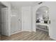 Bathroom featuring a glass shower and a view to the main bedroom with an archway at 1135 Marni Ridge Ct, Kissimmee, FL 34747