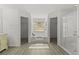 Elegant bathroom featuring natural light, a soaking tub, and a glass enclosed shower at 1135 Marni Ridge Ct, Kissimmee, FL 34747