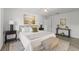 Spacious bedroom featuring natural light, hardwood floors, and neutral color palette at 1135 Marni Ridge Ct, Kissimmee, FL 34747