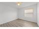 An empty bedroom with a window with blinds, ceiling fan, and vinyl floors at 1135 Marni Ridge Ct, Kissimmee, FL 34747