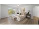 Inviting bedroom featuring natural light, neutral decor, and an area rug at 1135 Marni Ridge Ct, Kissimmee, FL 34747