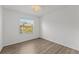 Cozy bedroom with wood floors and a window offering natural light at 1135 Marni Ridge Ct, Kissimmee, FL 34747