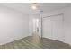 An empty bedroom with closet, doorway, ceiling fan, and light vinyl floors at 1135 Marni Ridge Ct, Kissimmee, FL 34747