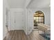 Bright foyer with hardwood floors, arched window, and neutral color scheme at 1135 Marni Ridge Ct, Kissimmee, FL 34747