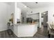 Bright kitchen with granite counters, ample cabinets, stainless appliances, and a view to the dining area at 1135 Marni Ridge Ct, Kissimmee, FL 34747