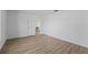 Spacious living room featuring wood floors and an open doorway at 1135 Marni Ridge Ct, Kissimmee, FL 34747