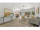 Open-concept living room with modern furniture, stylish decor, and views of the pool area at 1135 Marni Ridge Ct, Kissimmee, FL 34747