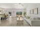 Inviting living room features neutral tones, comfortable seating, and sliding doors to outdoor living area at 1135 Marni Ridge Ct, Kissimmee, FL 34747