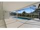Enclosed pool and spa area with a screened in area and backyard views at 1135 Marni Ridge Ct, Kissimmee, FL 34747