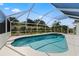 Enclosed pool and spa area with blue tile at 1135 Marni Ridge Ct, Kissimmee, FL 34747