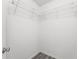 A walk-in closet featuring wire shelving and wood-look flooring at 1135 Marni Ridge Ct, Kissimmee, FL 34747