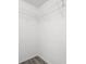 A walk-in closet featuring wire shelving and wood-look flooring at 1135 Marni Ridge Ct, Kissimmee, FL 34747