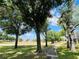 Scenic walking path surrounded by lush greenery and trees, perfect for leisurely strolls and enjoying nature at 1135 Marni Ridge Ct, Kissimmee, FL 34747
