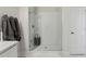 Sleek bathroom featuring a glass-enclosed shower with white subway tile and minimalist design at 11725 Verrazano Dr, Orlando, FL 32836