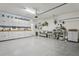 Spacious garage features ample storage cabinets, workbench area, and well-organized shelving at 11725 Verrazano Dr, Orlando, FL 32836