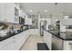 Spacious kitchen featuring stainless steel appliances, granite countertops, and ample storage at 11725 Verrazano Dr, Orlando, FL 32836