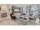 Inviting living room with stylish decor, large windows, and comfortable seating arrangement at 11725 Verrazano Dr, Orlando, FL 32836