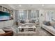 Cozy living room features built-in shelving, comfortable seating, and natural light at 11725 Verrazano Dr, Orlando, FL 32836