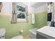 Classic bathroom with vintage tiles, a tub, and a window allowing natural light at 1207 Cole Rd, Orlando, FL 32803