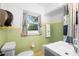 Well-maintained bathroom with bright tiles, fresh decor, and essential fixtures at 1207 Cole Rd, Orlando, FL 32803