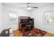 Bright room perfect for an office, featuring hardwood floors, natural light, and a modern desk setup at 1207 Cole Rd, Orlando, FL 32803