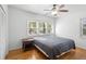 Comfortable bedroom with hardwood floors and bright windows, complemented by ample natural light at 1207 Cole Rd, Orlando, FL 32803