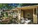 Charming single-story home with a covered carport, mature landscaping, and a welcoming front porch at 1207 Cole Rd, Orlando, FL 32803