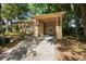 Charming single-story home with a covered carport and lush landscaping at 1207 Cole Rd, Orlando, FL 32803