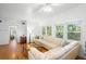 Spacious living room with hardwood floors, a comfortable sectional, and multiple windows for natural light at 1207 Cole Rd, Orlando, FL 32803