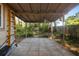 Spacious covered patio with concrete flooring and a view of the lush backyard, perfect for outdoor living and entertaining at 1207 Cole Rd, Orlando, FL 32803