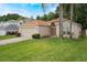 Lovely single-story home with manicured lawn and a two-car garage in a residential neighborhood at 122 Oak View Pl, Sanford, FL 32773