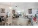 Bright, open-concept living and dining area featuring neutral colors and stylish decor at 122 Oak View Pl, Sanford, FL 32773
