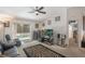 Cozy living room with a sliding glass door leading to the pool area, perfect for indoor-outdoor living at 122 Oak View Pl, Sanford, FL 32773