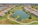 Breathtaking aerial shot of a community with a lake, golf course, and beautiful homes at 13090 Bromborough Dr, Orlando, FL 32832