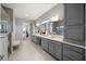 This spacious bathroom features a double vanity, with a shower and a walk-in closet adjacent to the room at 13090 Bromborough Dr, Orlando, FL 32832