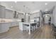 Kitchen with stainless steel appliances, center island, and light gray walls at 13090 Bromborough Dr, Orlando, FL 32832