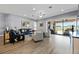 Comfortable living room with wood flooring, neutral walls, and an abundance of natural light at 13090 Bromborough Dr, Orlando, FL 32832