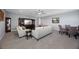 Spacious living area with carpet, seating, and dining table at 13090 Bromborough Dr, Orlando, FL 32832