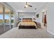 Well-lit bedroom with private balcony access and an ensuite bathroom at 13090 Bromborough Dr, Orlando, FL 32832