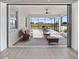 Inviting screened-in lanai with brick pavers, comfortable seating, and a view of the lush green lawn at 13090 Bromborough Dr, Orlando, FL 32832