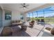 Covered patio with brick flooring, comfortable seating, and scenic views at 13090 Bromborough Dr, Orlando, FL 32832
